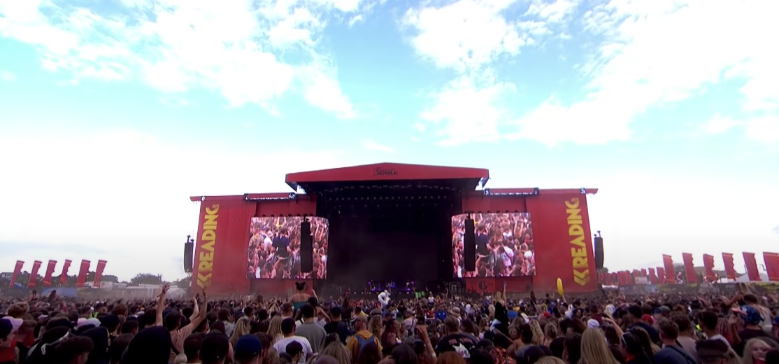 Photo of an open concert ground filled with a massive crowd of people